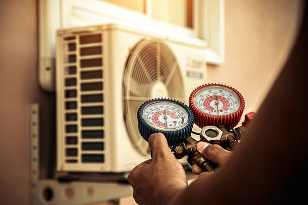 Professional Heat Pump Repair technician working in Gloversville, NY